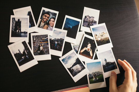 Making an album with polaroid photos of a couple's trip