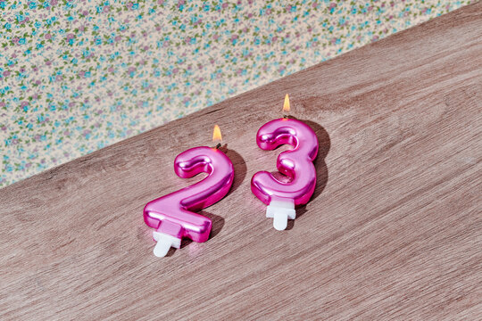 lit number-shaped candles form the number 23