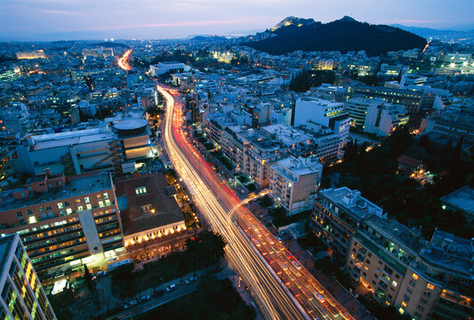 Mesogeion Avenue lit by moving traffic in Athens, Greece.