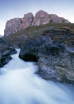 An unnamed tributary of the Anaktuvuk River frames a limestone headwall in Alaska's Gates of the Arctic National Park.
