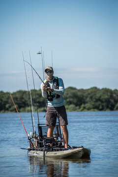 Angler Makes A Cast Out Of His Yak