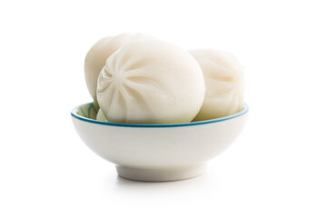 Xiaolongbao, traditional steamed dumplings in bowl. Xiao Long Bao buns isolated on white background.