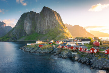 Beautiful sunrise over Hamnoy, fishermen village with the typical red houses of the Lofoten Islands...