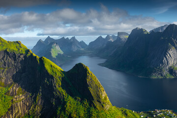 Amazing landscape of the Lofoten Islands from the top of Reinebringen Mountain with blue sky , Norway