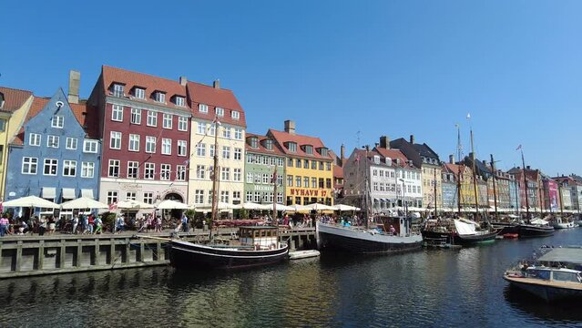 Colorful houses at new harbour waterfront in Copenhagen, Denmark - pan from left to right