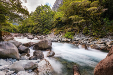 Hollyford river cascading through the mountains and rainforest of South Island, New Zealand, on Highway 94 to MIlford Sound