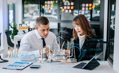 Business people having consultation about wind energy at company office. Business team discussing about windmill and alternative green enery. Executive meeting at modern office.