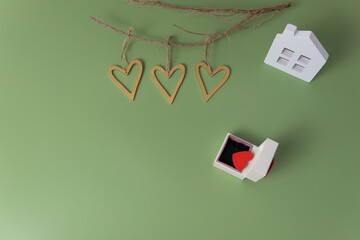 Romantic background with hearts and house, symbol of love and commitment