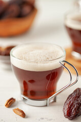 Cup with dates coffee  with date seeds. Healthy plant drink for immunity. Coffee alternatives