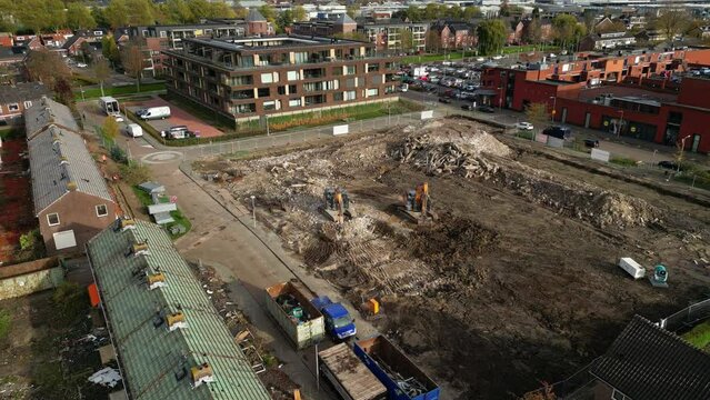  Heavy machinery demolishing debris and turning it into finer gravel. Heavy-duty machinery.