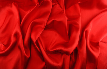 Red silk fabric background closeup