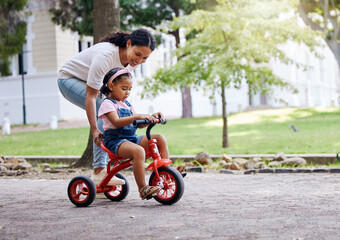Mother teaching child, bike and learning in park, outdoor with growth and development, family and...