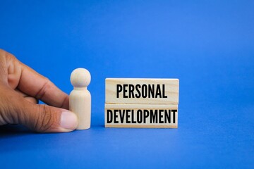 wooden figure with the word personal development. the concept of self-development. the concept of self-motivation. self improvement