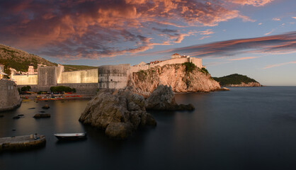 panoramic sunset view to the city skyline of Dubrovnik's Old City with dramatic sky, Croatia