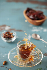 Cup with dates coffee  with date seeds. Healthy plant drink for immunity. Coffee alternatives