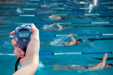Composite image of close-up of a woman holding a chronometer to measure performance