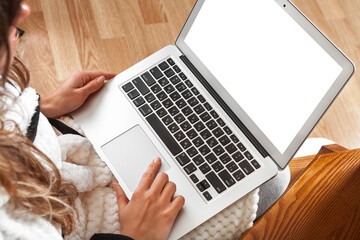 Fototapeta premium girl in a bathrobe with a laptop in her hands. Mockup