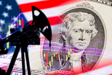 A stock price of oil producing corporations.America petroleum Crisis.US petroleum and gas industry concept.Cost of oil and gas companies.Current dollar Jefferson portrait.Oil pump usa flag background.