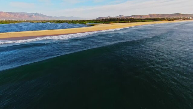 FPV Drone shot Over the Ocean Along the Beautiful Beach in Baja Region of Mexico