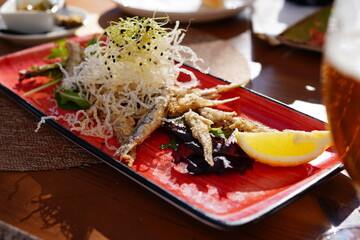 Boquerones fritos, typical Spanish tapas, Spanish fried anchovies	