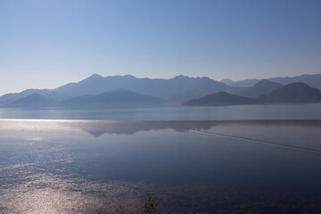 Scenic view on beautiful lake of Skadar National Park on sunny autumn day seen from Vranjina, Bar, Montenegro, Balkans, Europe. Travel destination, Dinaric Alps near Albania. Magical water reflection