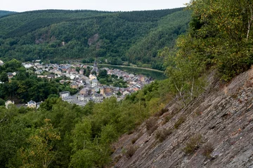 Fototapeten MontThermé, a smalle village in the French Ardennes, in the Maas Valley © twanwiermans