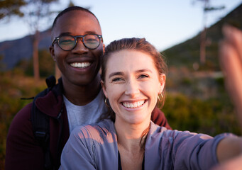 Nature, selfie and portrait of interracial couple on mountain for holiday, vacation and hiking adventure on weekend. Travel, wellness and happy man with woman enjoy calm, freedom and peace at sunset