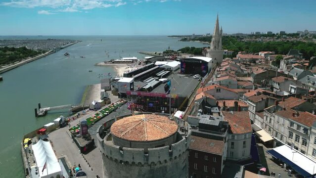 Francofolies 2022 event with Lantern Tower in background at La Rochelle, Charente-Maritime department in France. Aerial birdseye view