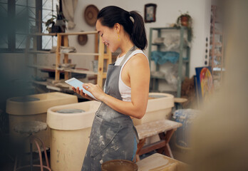 Tablet, pottery and woman typing for small business, online store and website for clay, sculpture and art. Creative workshop, digital tech and girl do inventory, ecommerce and sell ceramic products