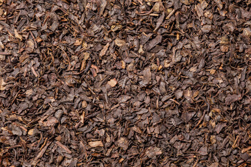 Fototapeta premium Tea, dried leaves brown, background uniform texture, bunch in bulk, close-up macro top view