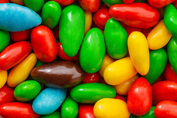 Candy glaze in bulk, red, green, yellow, blue, white, brown, close-up, macro, supermacro, mini pieces, wallpaper background