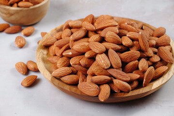 Almond in wooden bowl.on table 