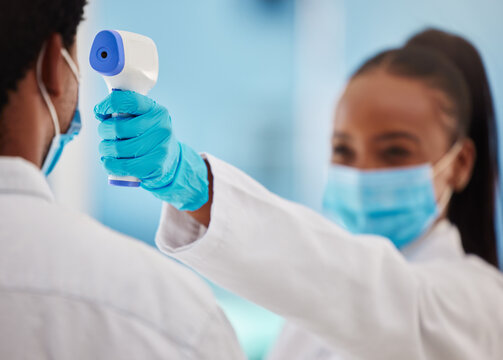 Doctor, Patient And Covid 19, Healthcare And Thermometer For Temperature Check Zoom And Black People In Medicine. Face Mask, Corona And Virus Prevention, Man And Woman In Clinic For Medical Screening