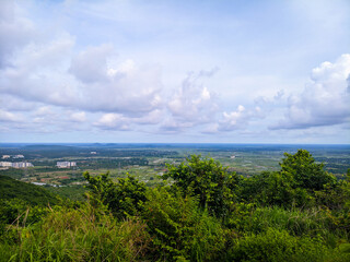 selective focus picture of mountains and clouds in the rainy season