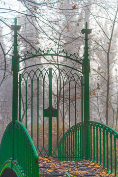 Metal gate on the bridge in the park in autumn. Enjoy peace and quiet in nature.