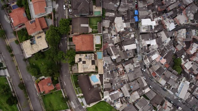 Aerial View Of Class Distinction In Brazil, A Wall Separating The Rich From The Poor In Sao Paulo