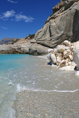 White rocky bay forming natural shadow and beautiful pebble beach in exotic Caribbean island