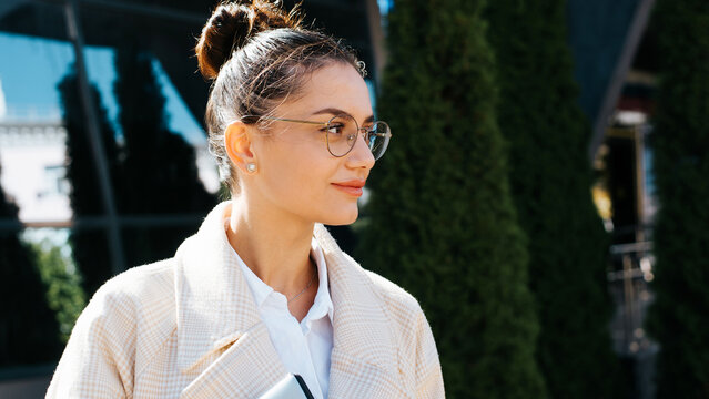 Side View Portrait Beautiful Cute Smiling Young Brunette Woman Wearing Round Glasses And Looking Away, Outdoors