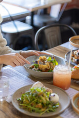 Breakfast Dishes at Cafe with woman female hand