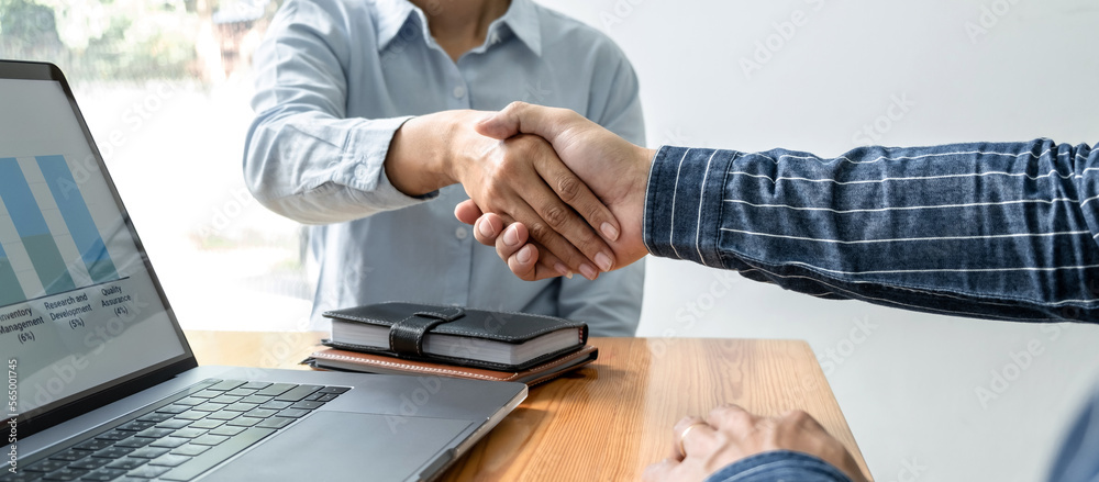 Poster two business people shaking hands after discussing a good deal of contract agreement and new project