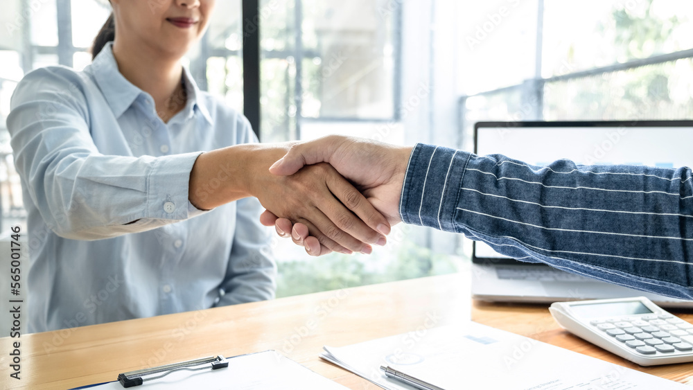Poster two business people shaking hands after discussing a good deal of contract agreement and new project