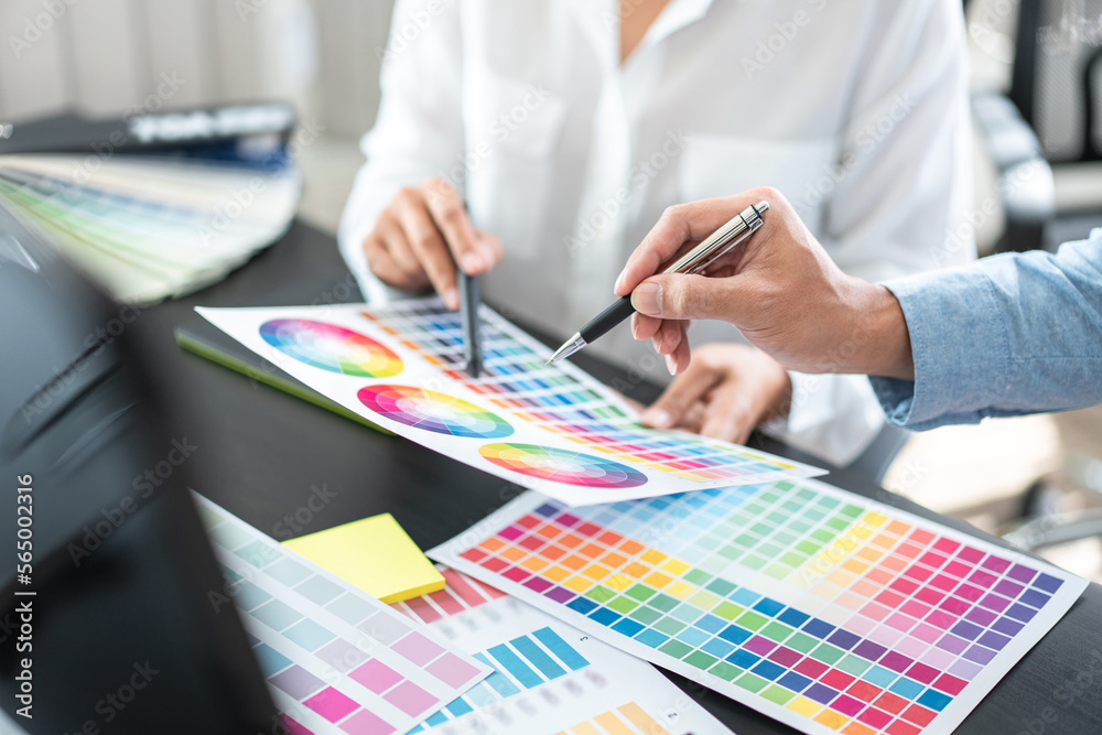 Poster two creative graphic designer team working on color selection an