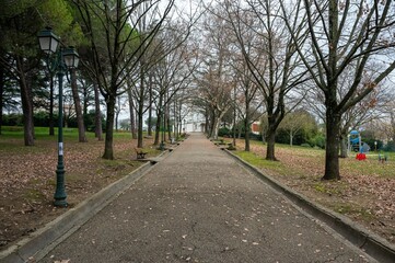Ales, Occitanie, France, Empty lane of a park towards the municipality museumm of history