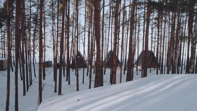 Aerial photography glamping in the winter forest, winter camping in the pine forest