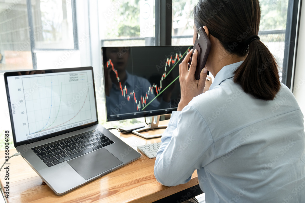 Poster businesswoman investor having planning and analyzing graph data with display screen the data present