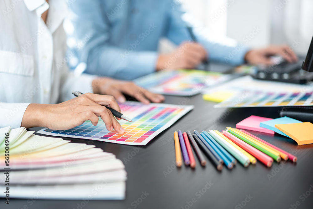 Aufkleber Team of creative graphic designer working on color swatch samples chart for selection coloring in inspiration to create new collection at workplace