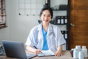 Female medicine doctor hand holding silver pen writing something on clipboard close up. Ward round, patient visit check, medical calculation and statistics concept.