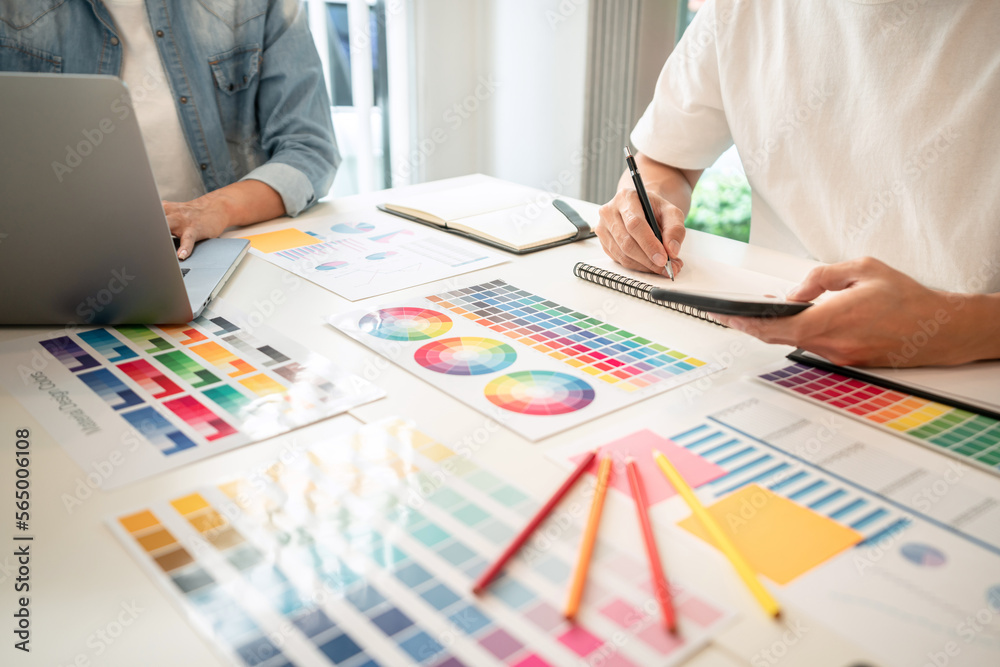 Poster two creative graphic designer team working on color selection an