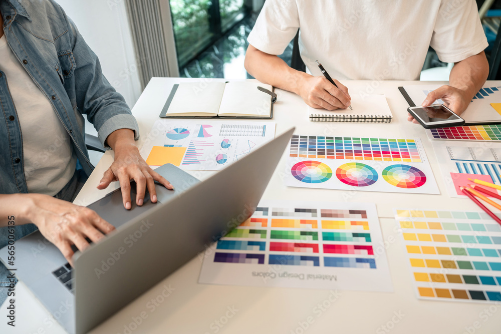Poster two creative graphic designer team working on color selection an