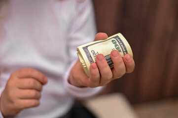 money in the child's hand.